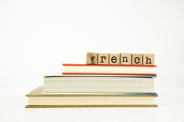 french language word on wood stamps and books