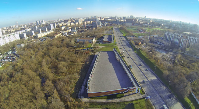 Cityscape at sunny day. View from unmanned quadrocopter