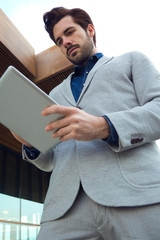 Fototapeta premium Urban business man with laptop outside in airport