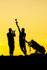 Golfer at sunset