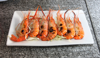 grilled of shrimp on white dish.