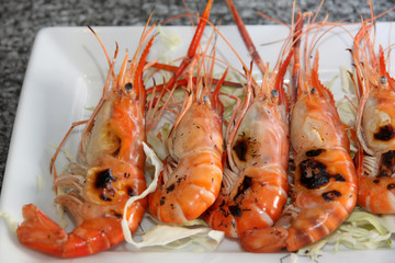 grilled of shrimp on white dish.