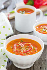 Roasted red pepper soup in white bowl
