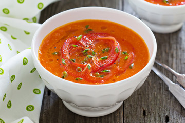 Roasted red pepper soup in white bowl