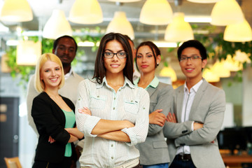 Patriotic businesswoman standing with USA flag 