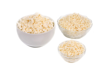 Cottage cheese in various bowls.