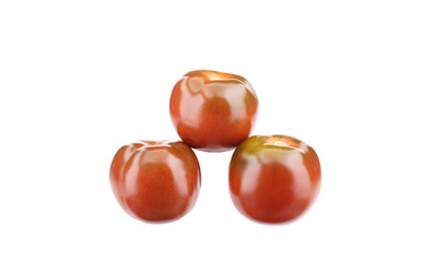 Three ripe tomatoes.