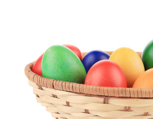 Easter eggs on wicker basket.