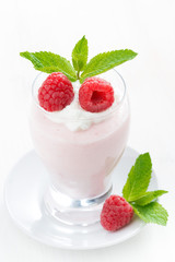 creamy jelly with raspberries in glass, vertical