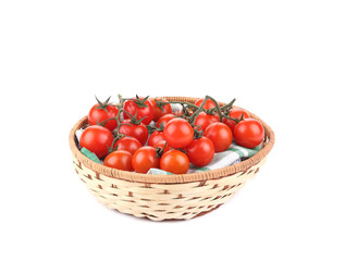 Fresh red tomatoes in a basket.