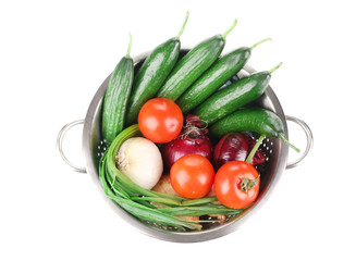 Vegetables in colander.