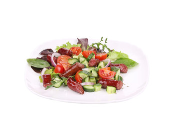 Fresh salad with sausage.