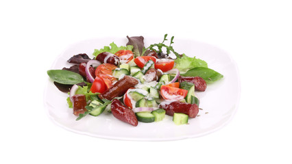 Fresh salad with sausage.