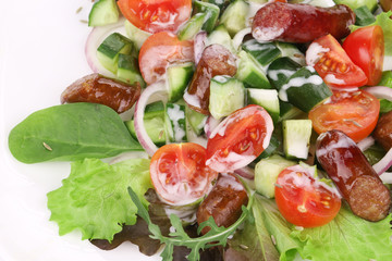 Salad with sausages. Close up.