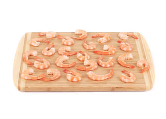 Boiled shrimps on cutting board.
