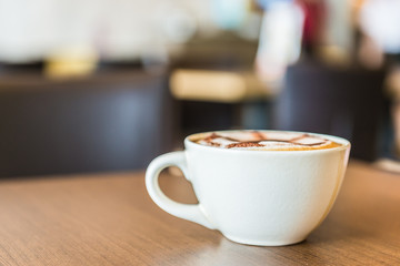 Coffee cup in coffee shop interior