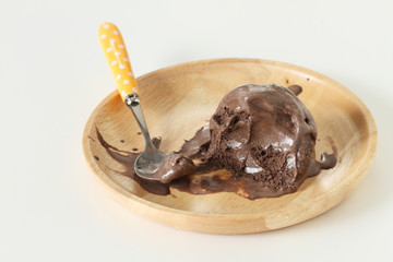 chocolate ice cream in wooden plate