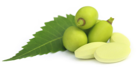 Medicinal neem fruits with tablets