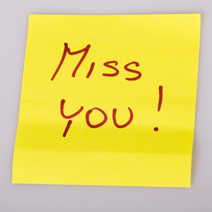 Yellow note paper miss you message