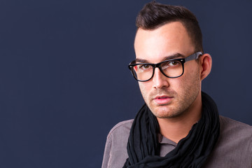 Obraz premium handsome young fashion man wearing scarf - shot in studio