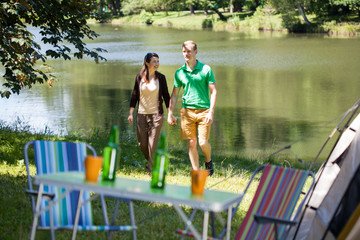 Couple walking by the lake