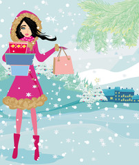 Plakat beautiful woman doing the shopping in winter