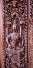 Old wooden door were carved Thai pattern