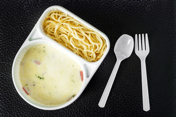 spaghetti carbonara with ham in the package
