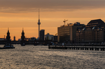 Berlin oberbaumbrucke with tv tower at sunset