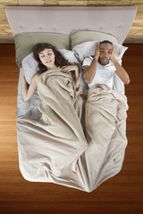 unable to sleep in bed because of snoring partner