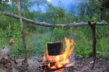Tourist kettle on camp fire