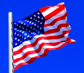 American flag against bright blue sky