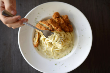 woman holding delicious spaghetti