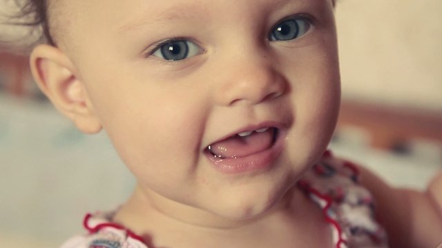 Cute fun baby girl closeup face looking. Vintage color