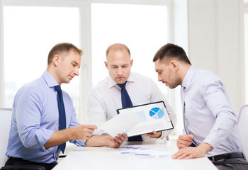 Fototapeta premium serious businessmen with papers in office