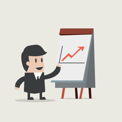 businessman points to chart of profit