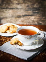 Tea with cookies on wooden background