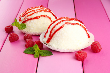 Delicious coconut cakes on table close-up