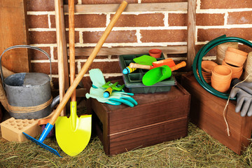 Tools of gardener on  bricks background