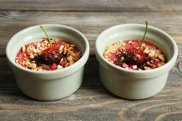 Tasty cherry dessert on table