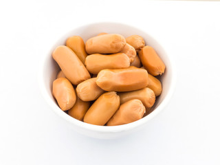 Cocktail sausages in white bowl