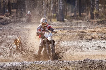 Fotobehang Motocross driver in mud © Teemu Tretjakov