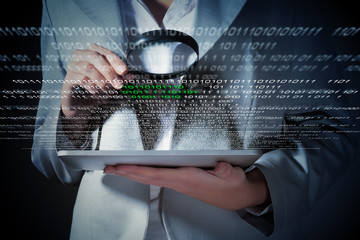 Businesswoman with magnifier glass