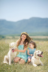 Beautiful girl playing with her dog. Outdoor portrait.