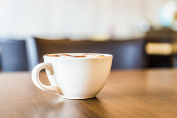 Coffee cup in coffee shop interior