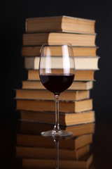 Wine glass and books
