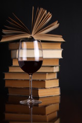Wine glass and books