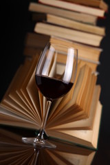 Wine glass and books
