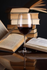 Wine glass and books