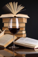 Wine glass and books